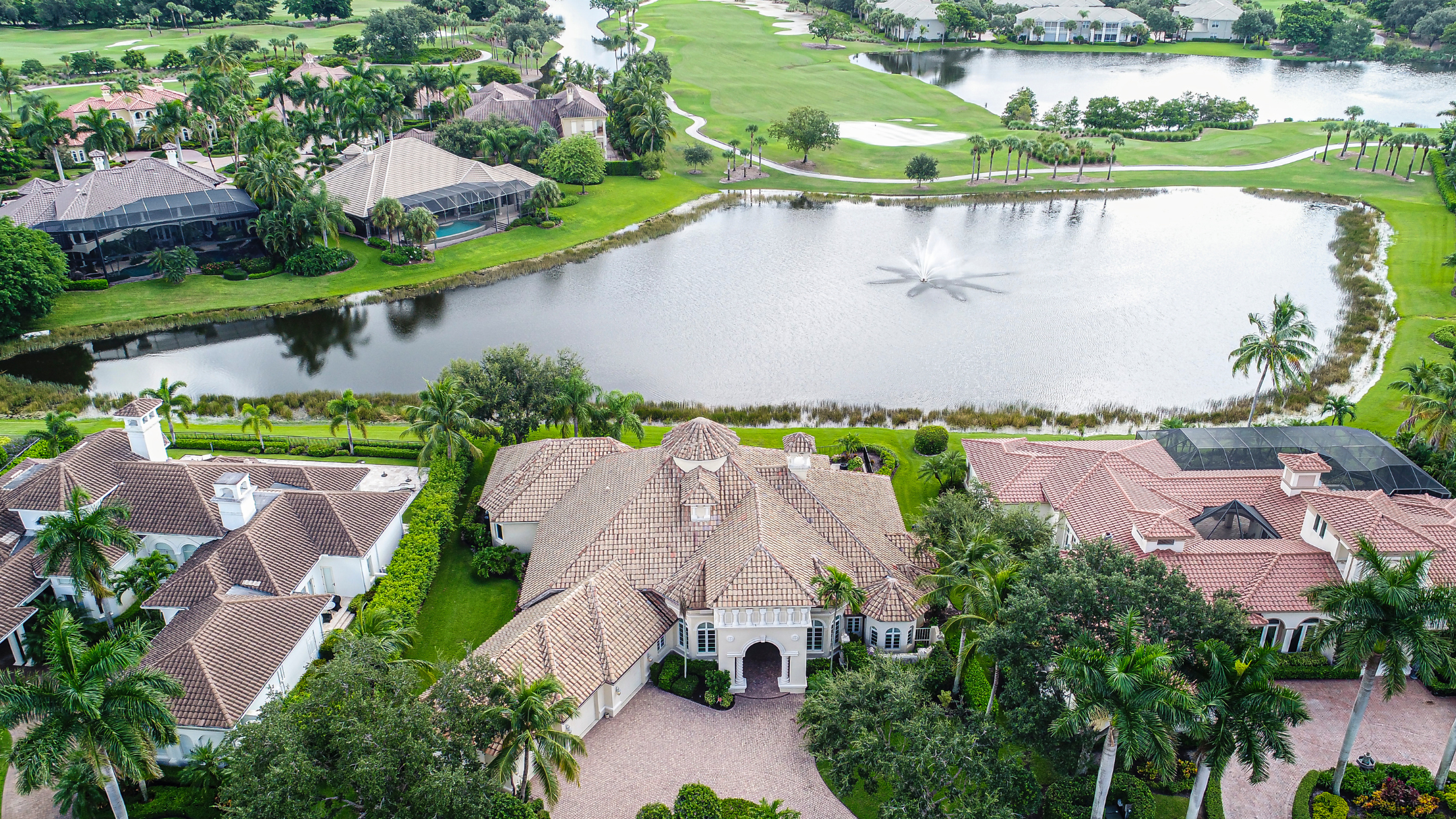 Aerial view of a gated community in Naples Florida showing residential estates and community amenities