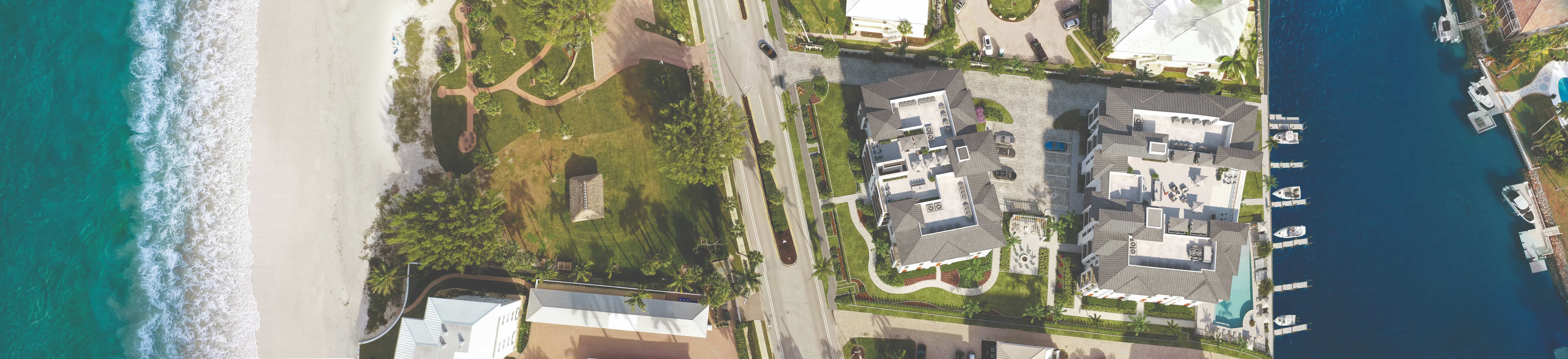 Twenty Twenty Gulfshore aerial site plan showing both buildings, marina, pool, and Gulf Shore Boulevard location (artist rendering)