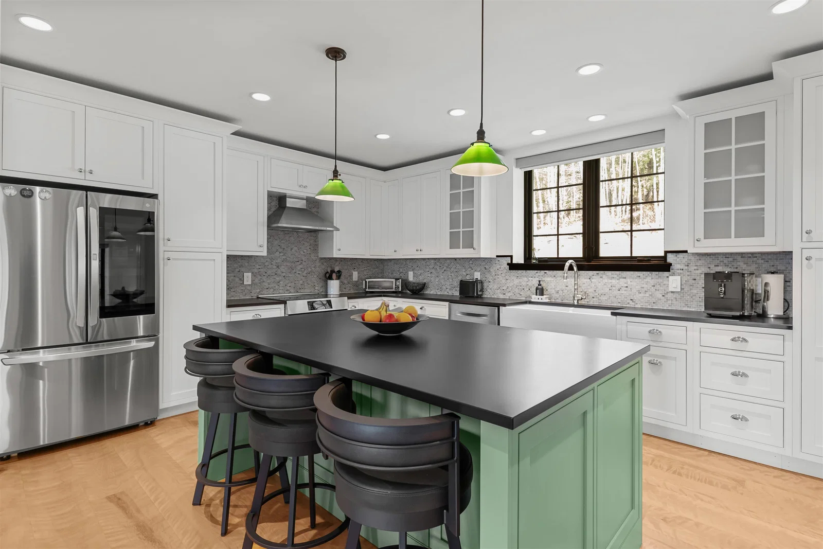 Modern Vermont luxury kitchen with oversized island and refined finishes