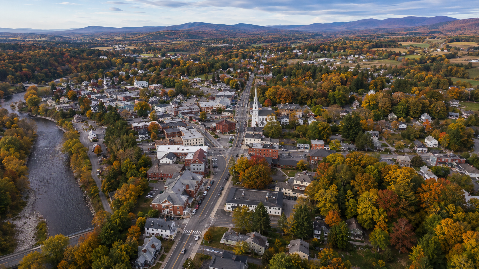 Aerial view of a Vermont village center surrounded by rural roads and homes