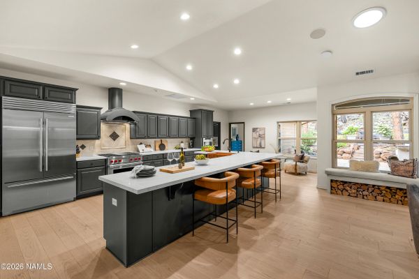 Newly renovated kitchen with new countertops and stainless appliances inside 2963 N Boldt Dr, a Flagstaff Arizona home for sale in Linwood Heights