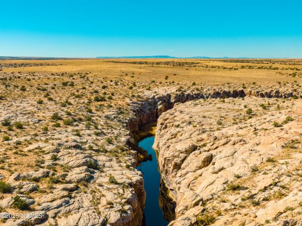 Chevelon Creek flowing through Rock Art Ranch historic Arizona landscape with canyon views