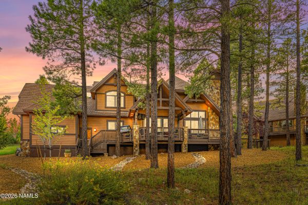 Covered deck with forest and panoramic mountain views at Pine Canyon home for sale in Flagstaff, AZ 86005