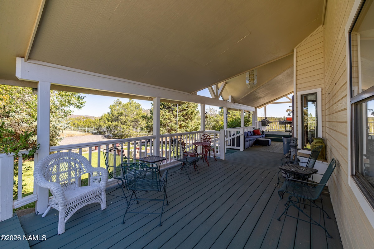 Covered deck overlooking 10 acres and San Francisco Peaks at 13074 Longhorn Way, Flagstaff, AZ