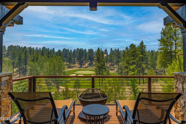 Expanded wrap-around Trex deck at 3385 S Tourmaline Dr with views of the creek, lake, and Pine Canyon's 16th and 17th fairways in Flagstaff, AZ