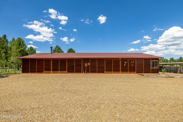 40x80 barn, covered stalls and 120x120 arena at this equestrian estate for sale in Parks, Arizona
