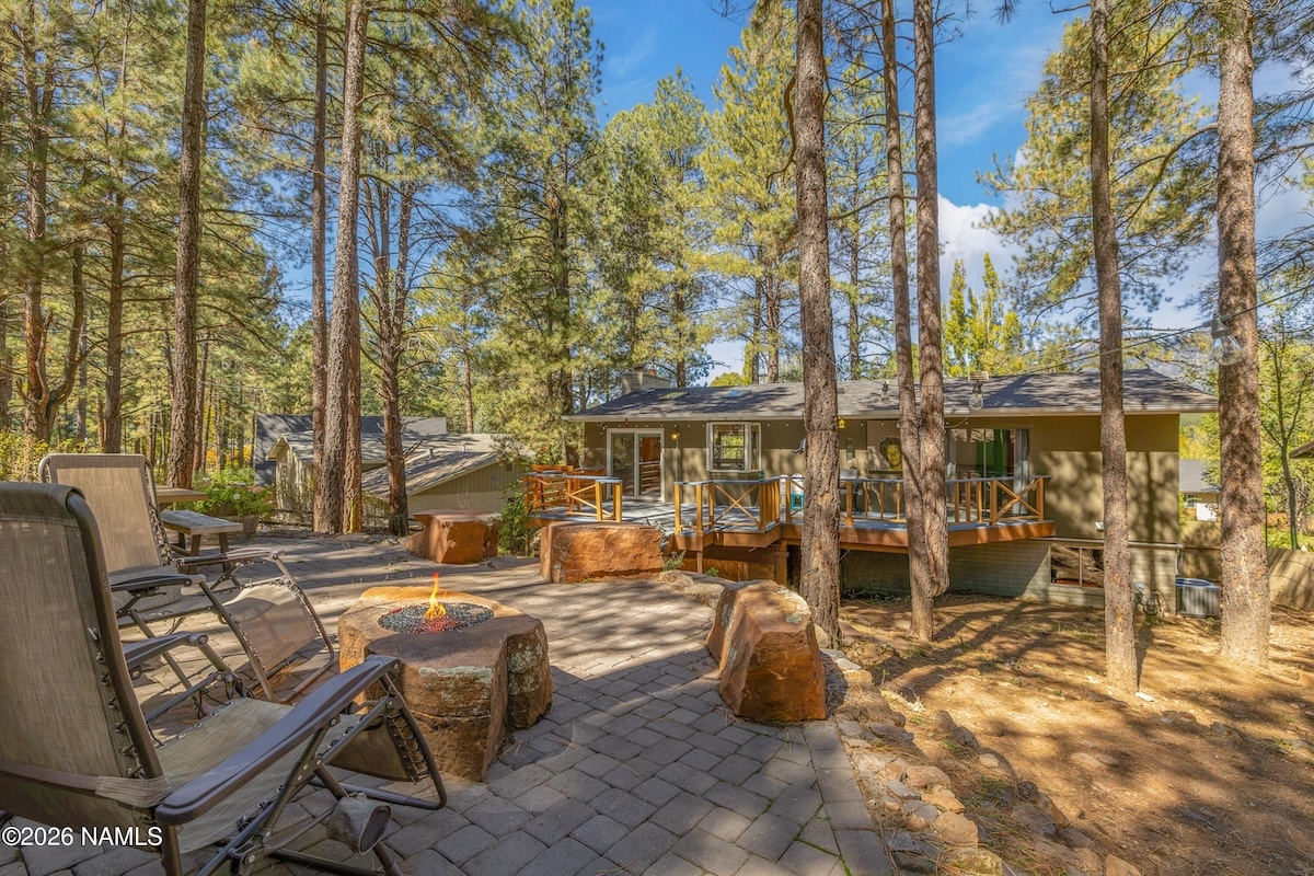 Private pine-shaded backyard backing to forested open space at 2857 W Darleen Dr, Flagstaff, AZ