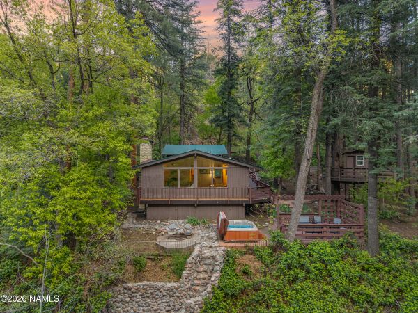 Wraparound deck overlooking Oak Creek Canyon with scenic red rock mountain views in Sedona Arizona