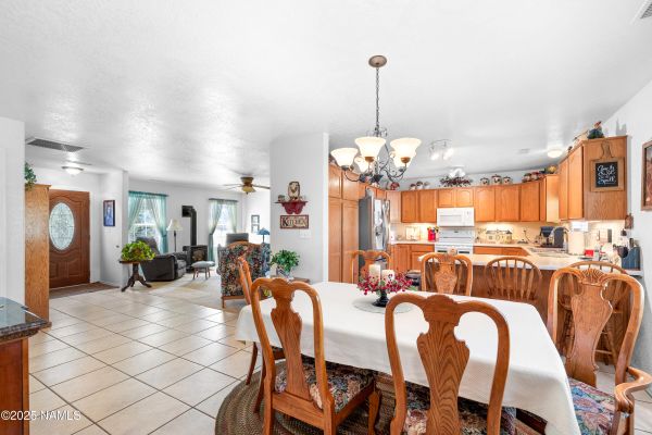Spacious kitchen inside a Flagstaff AZ home featuring generous counter space, ample storage, natural light, and comfortable mountain home living design.
