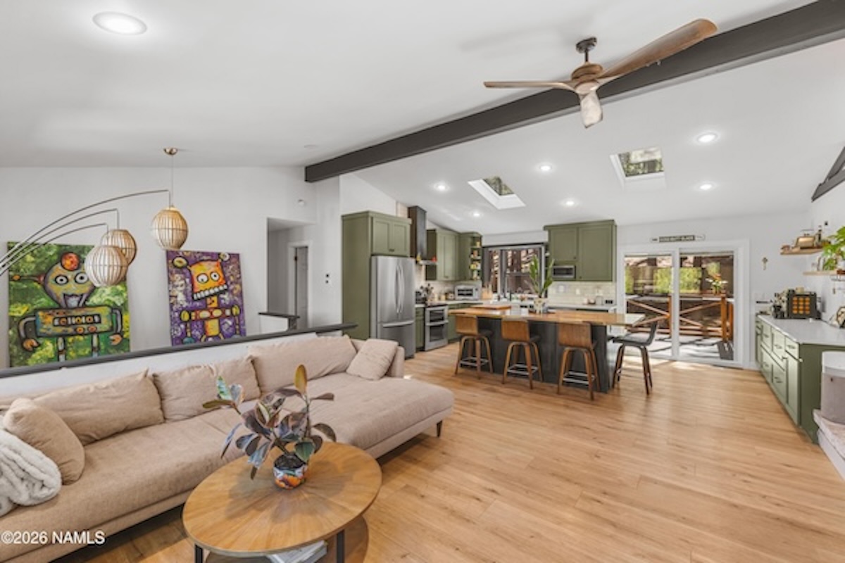 Remodeled vaulted great room with skylights and pellet stove at 2857 W Darleen Dr, Flagstaff, AZ