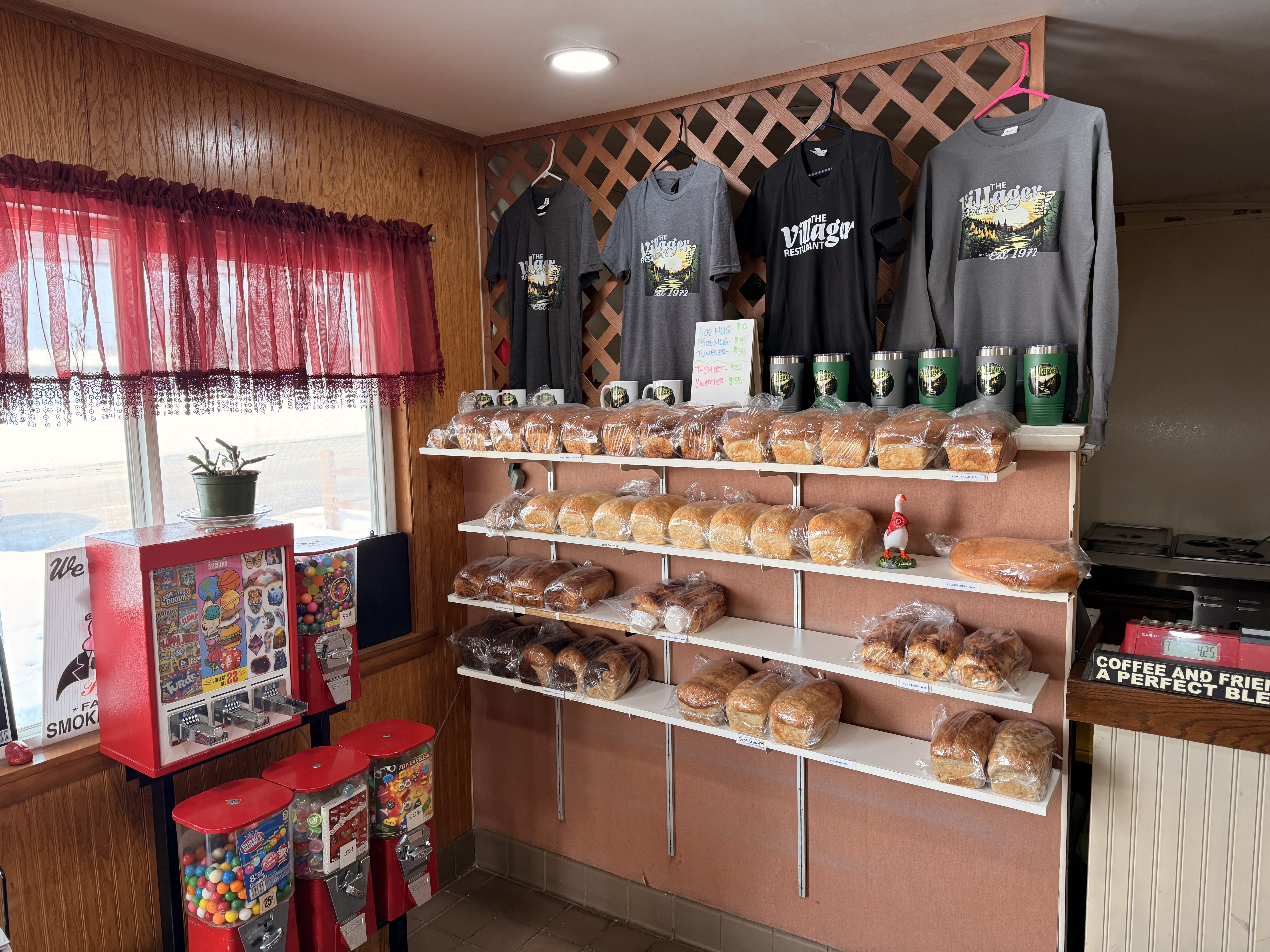 Fresh baked bread display and merchandise area at The Villager Restaurant in Lewiston, Michigan - Huston Real Estate