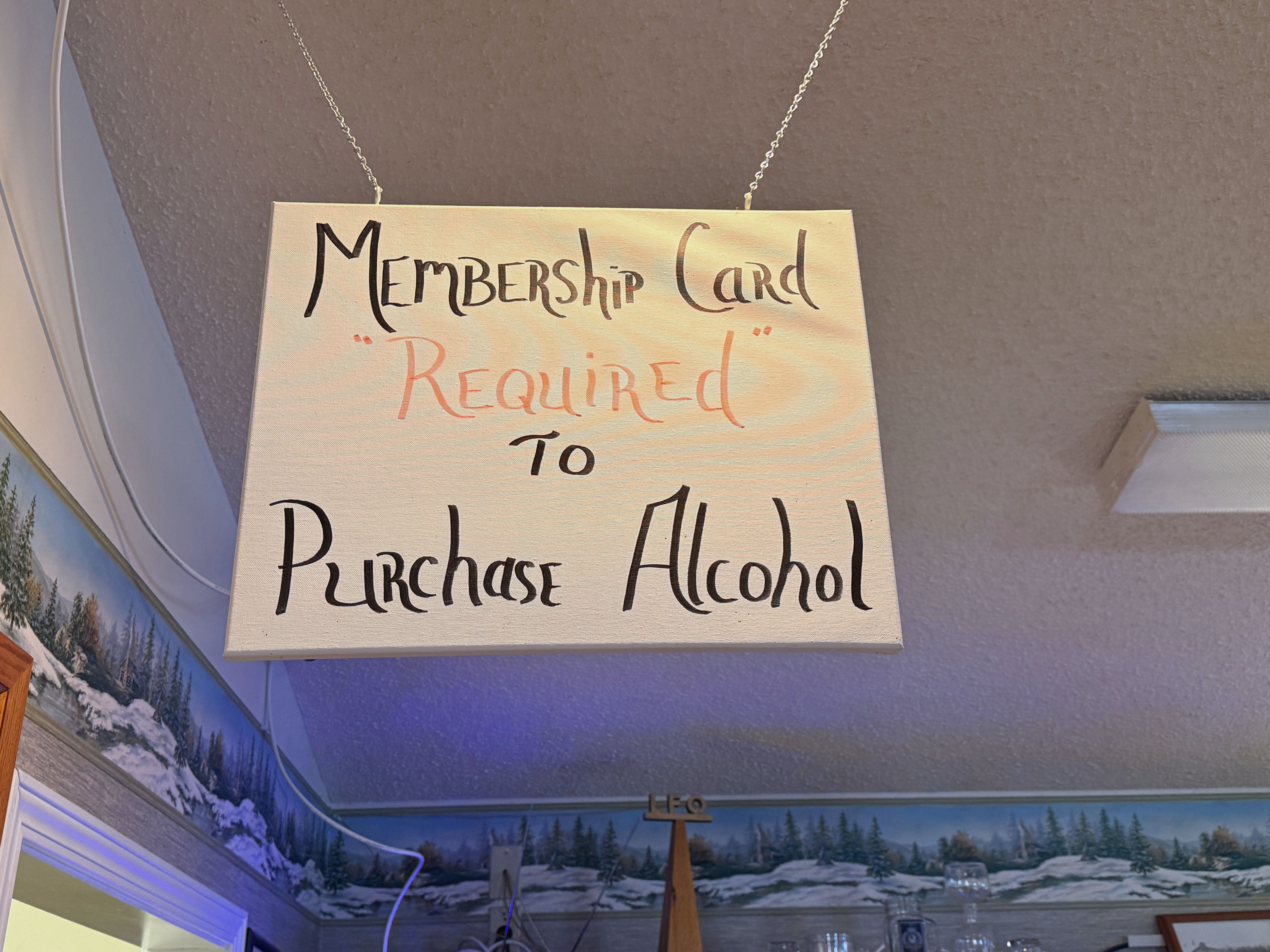 Membership card required sign at Fun Ones - Huston Real Estate