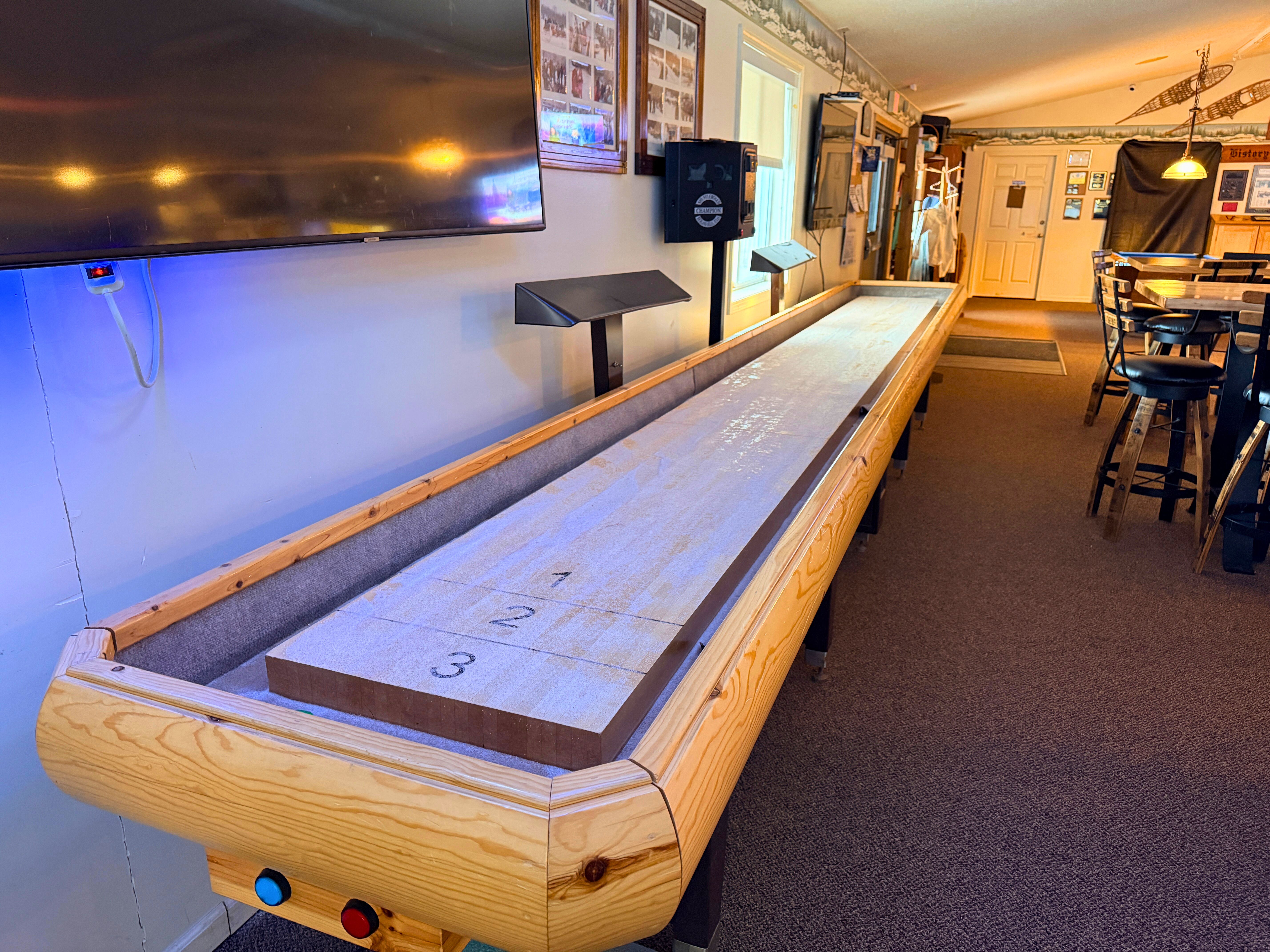 Indoor shuffleboard table at Fun Ones Lewiston - Huston Real Estate
