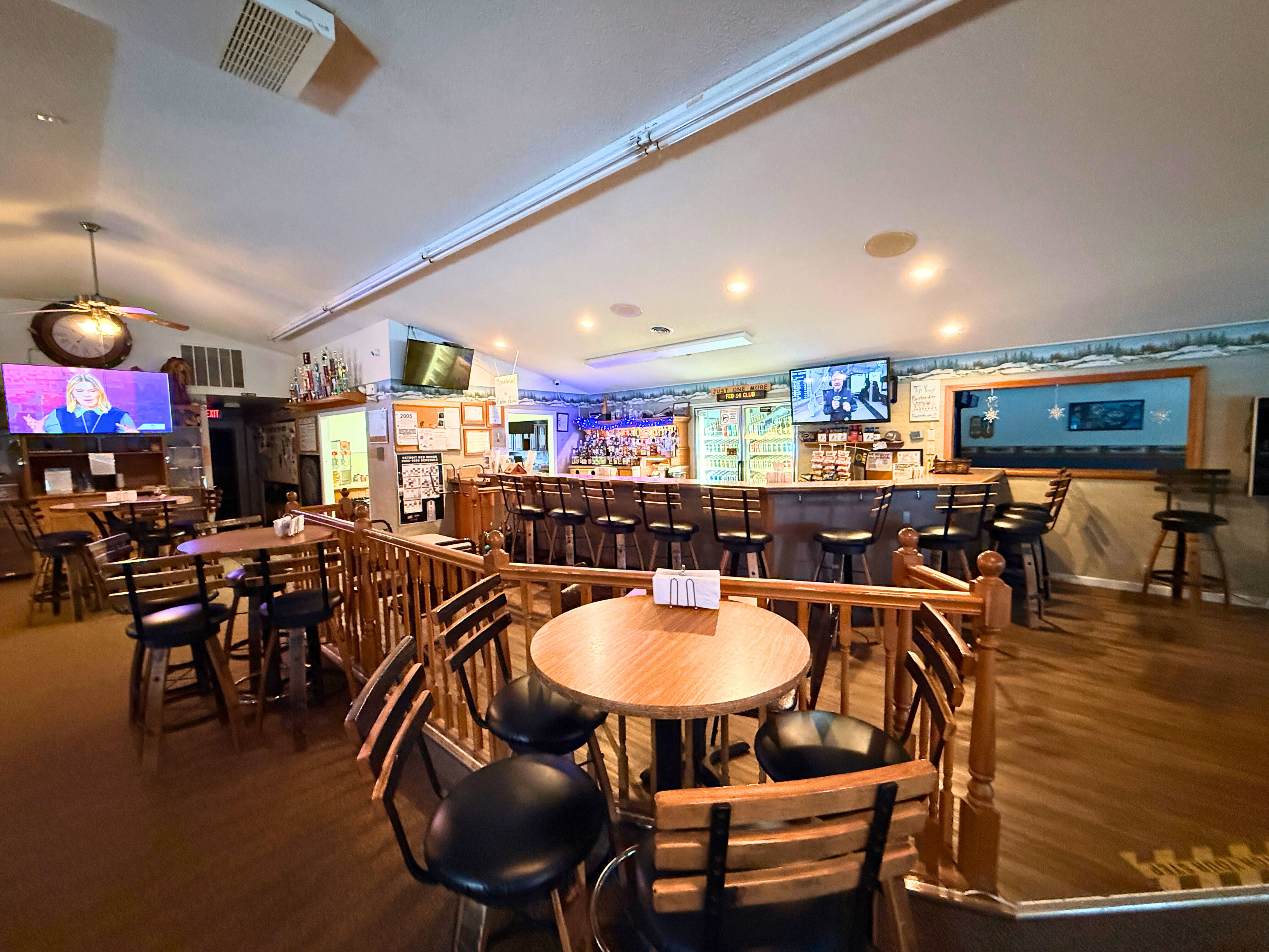 Wide view of bar and seating area at Fun Ones - Huston Real Estate