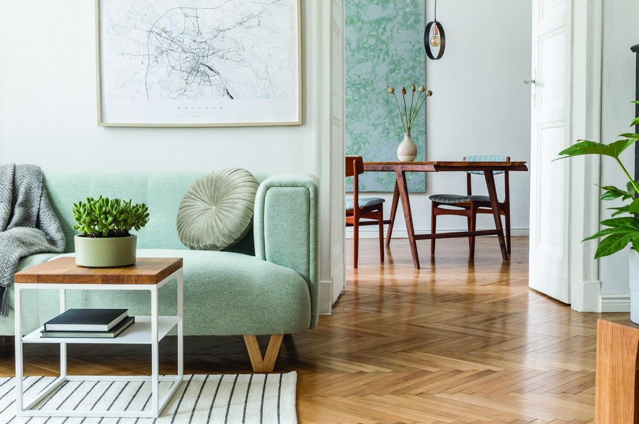 Cozy living room with a reading chair and dining area