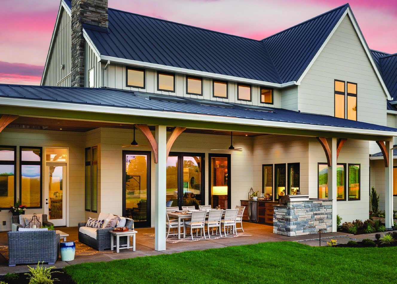 Farmhouse style home with a large covered back patio