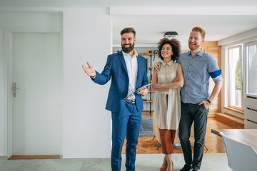 Happy couple moving to luxury house