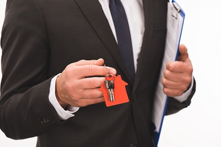 Real estate agent holding keys
