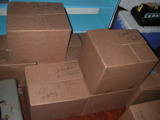 stacked moving boxes, tips for moving, how to make moving easier, moving into your new home, tips for moving into a new home, packing to move, tips to relocate