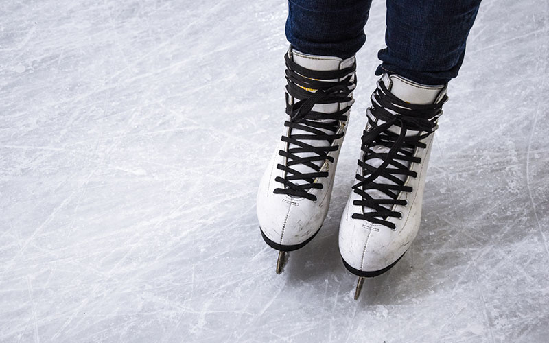 Indoor ice rink with skaters