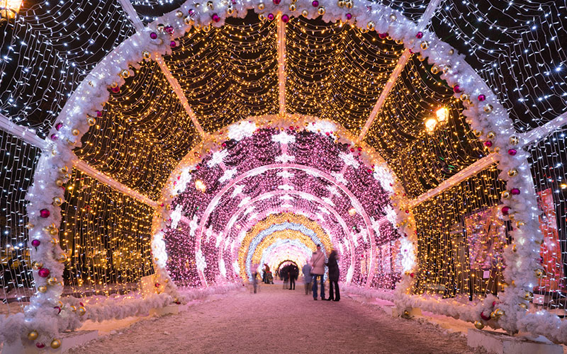 Walk-through tunnel of Christmas lights at night