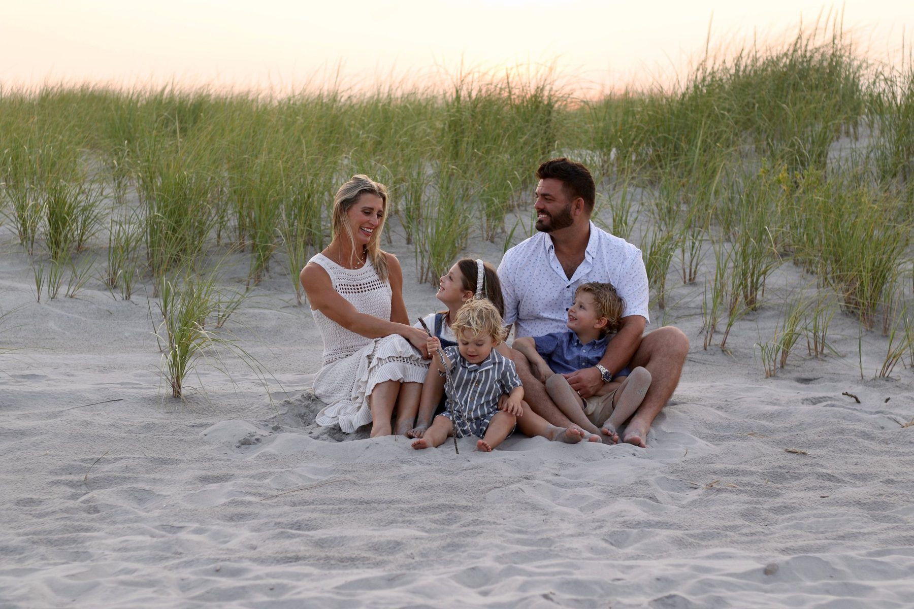 Graham and Alicia Ginn and their children on the dunes in Ocean City, NJ
