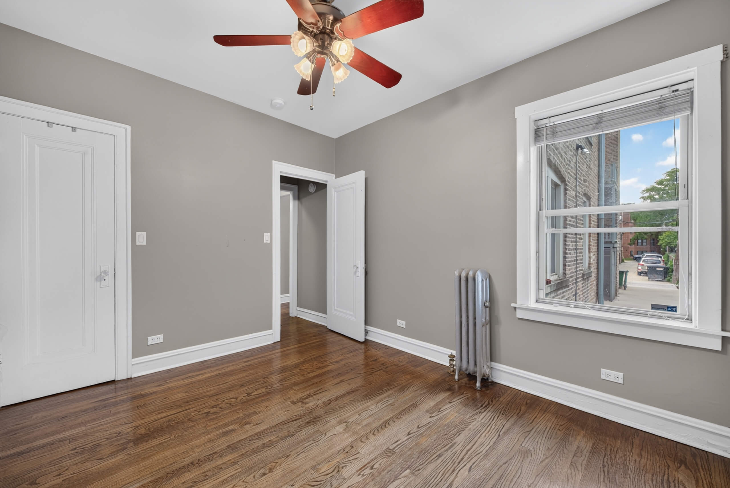 Bedroom with refinished hardwood floors at 845 S Humphrey Avenue Unit 1