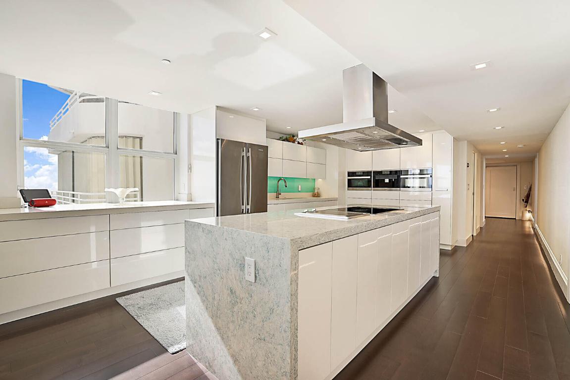 Waterfall stone island in the renovated chef's kitchen