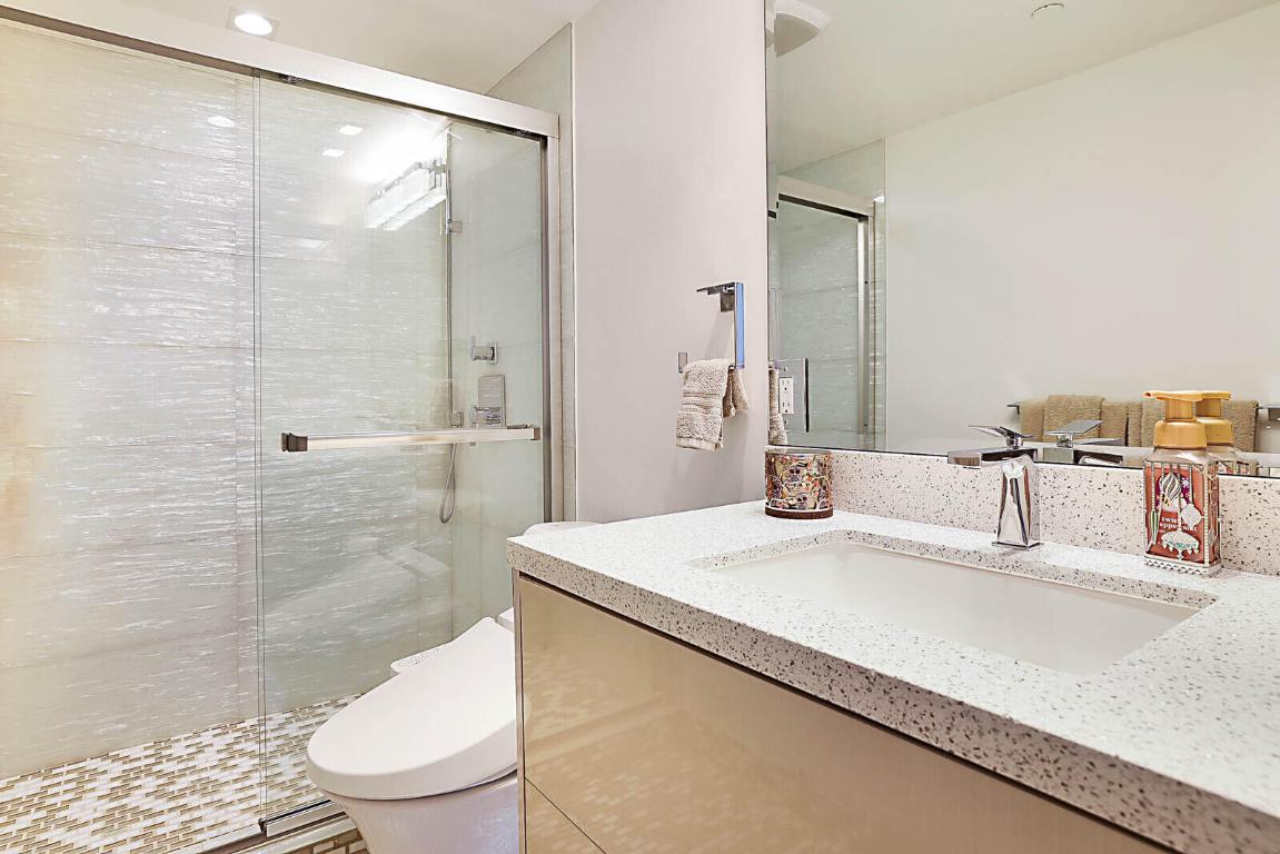 Renovated bath with frameless glass shower