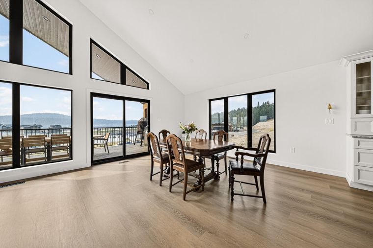 Dining area beside lake-facing windows at 1731 Marina Estates Road