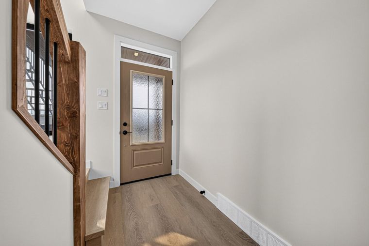 Entry hall with stairs to the upper living level at 1731 Marina Estates Road