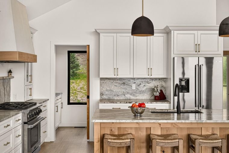 Kitchen island and white cabinetry at 1731 Marina Estates Road