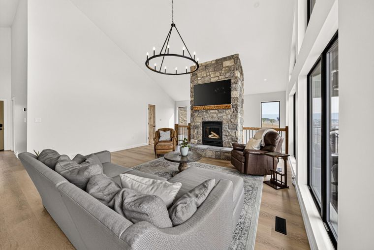 Living room seating beside the large windows at 1731 Marina Estates Road