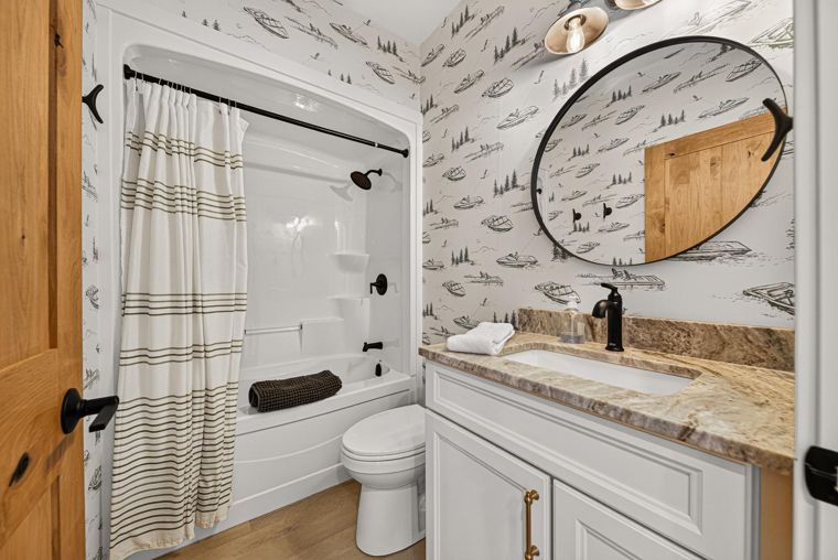 Lower-level bathroom with a bathtub at 1731 Marina Estates Road