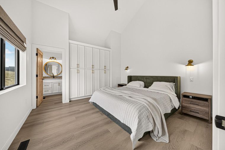 Primary bedroom with a vaulted ceiling at 1731 Marina Estates Road