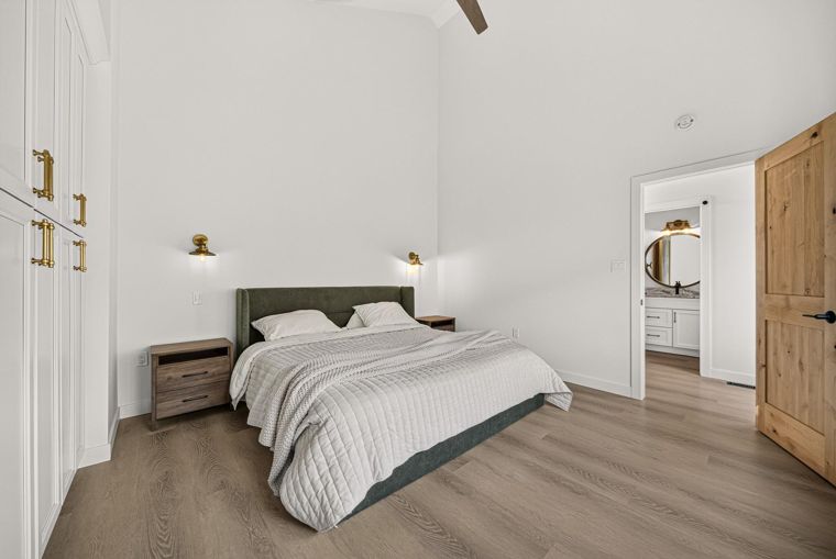Primary bedroom with an ensuite beyond at 1731 Marina Estates Road