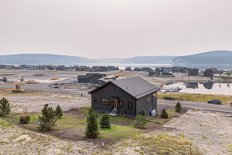 Home and surrounding hillside with lake beyond at 1731 Marina Estates Road