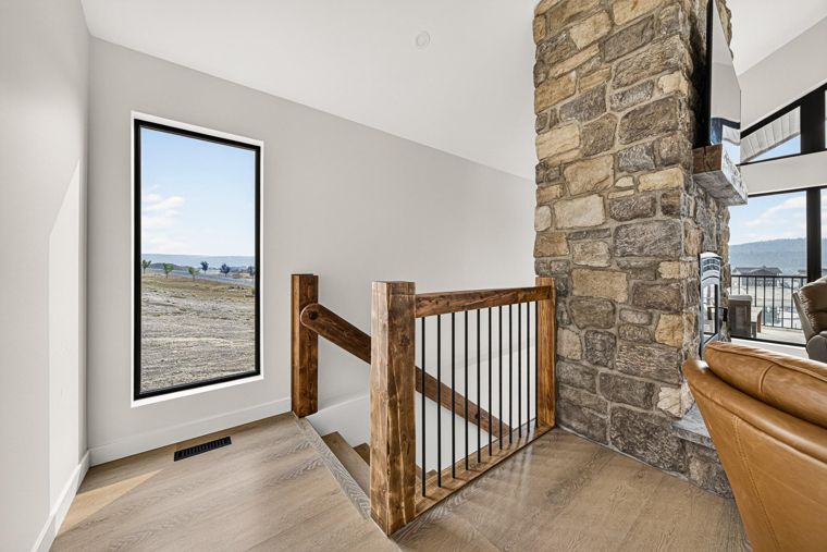 Upper stairway and fireplace stonework at 1731 Marina Estates Road