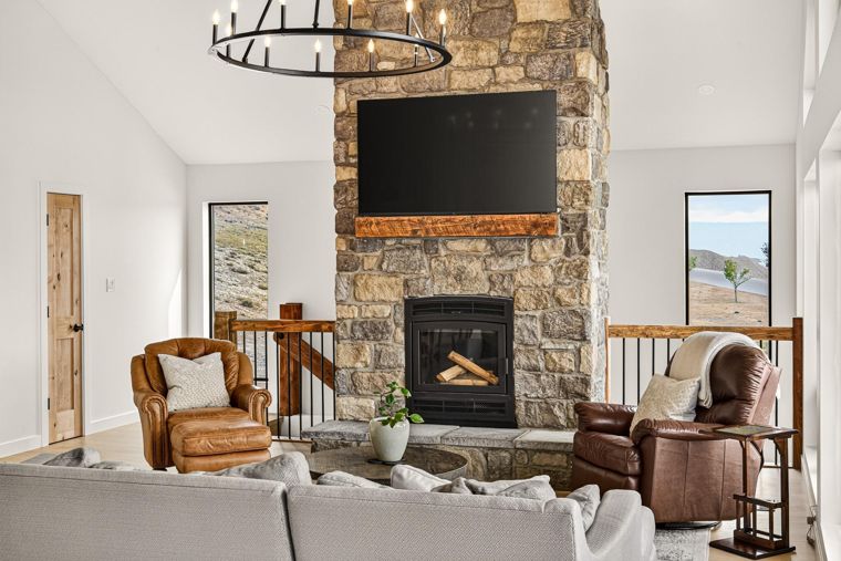 Living room with a full-height stone fireplace at 1731 Marina Estates Road
