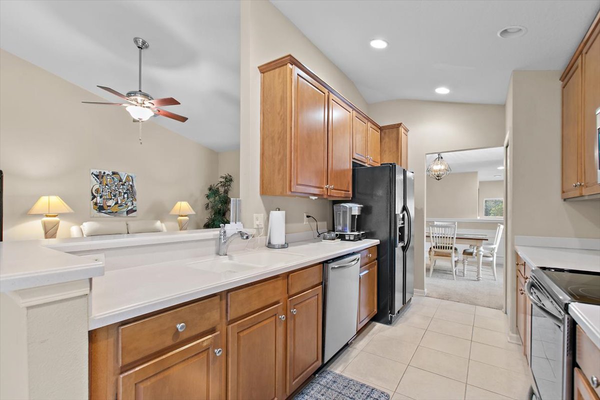 Kitchen with breakfast bar at 8555 Little Swift Circle in The Tides at Sweetwater by Del Webb