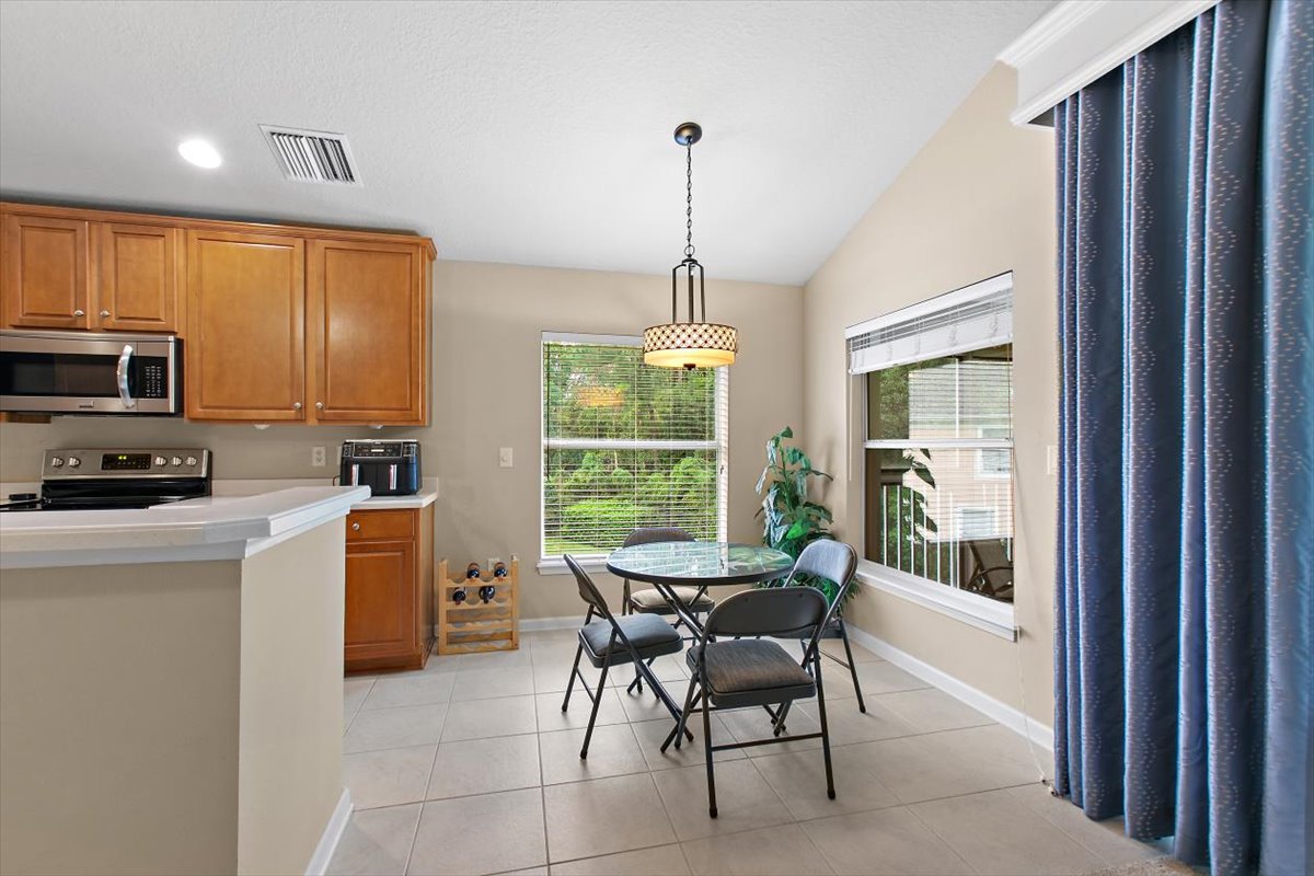 Eat-in kitchen and dining area at 8555 Little Swift Circle in Sweetwater by Del Webb, Jacksonville Florida