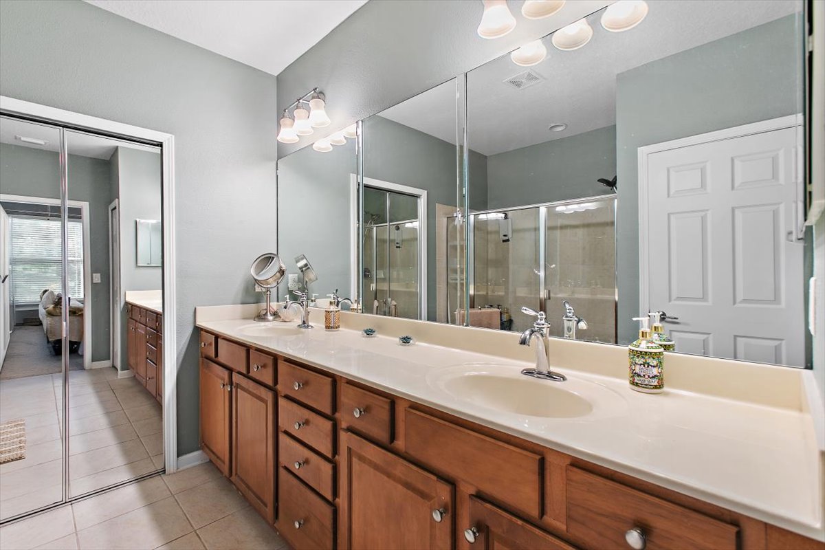 Primary bathroom with double-sink vanity at 8555 Little Swift Circle in The Tides at Sweetwater by Del Webb