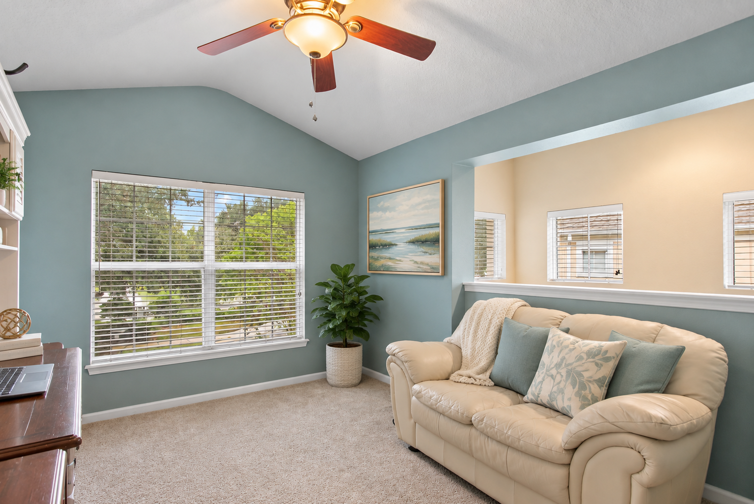 Den and home office with natural light and pond view at 8555 Little Swift Circle in Jacksonville Florida