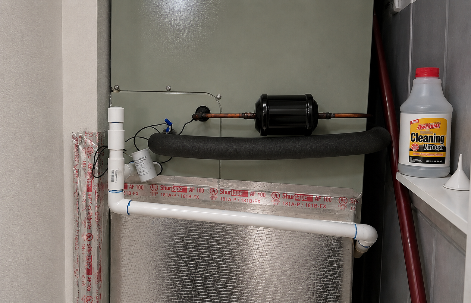 Cleaning an AC condensate drain line in a Ponte Vedra Beach Florida home