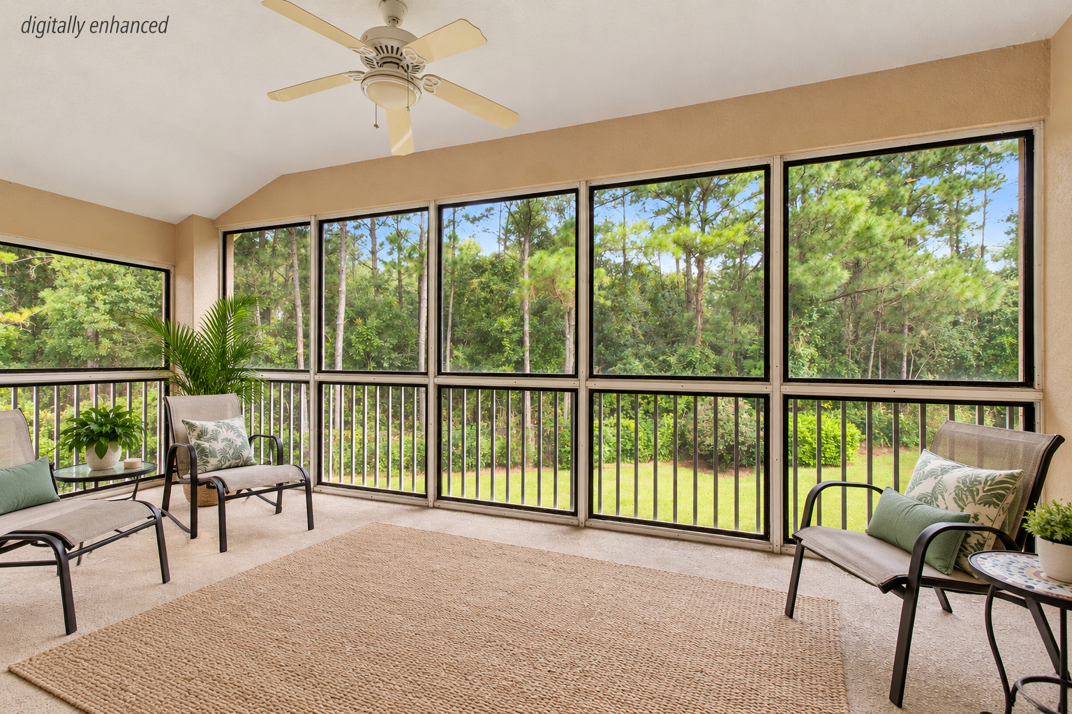 Screened lanai overlooking a broad lawn and mature trees at 8555 Little Swift Circle in Sweetwater by Del Webb, Jacksonville Florida