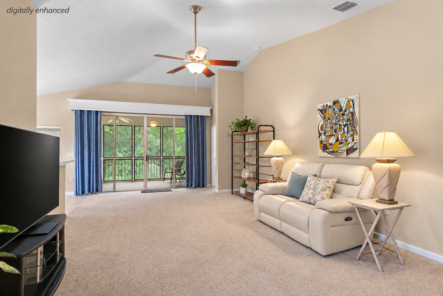 Living room with vaulted ceiling and natural light at 8555 Little Swift Circle in The Tides at Sweetwater by Del Webb