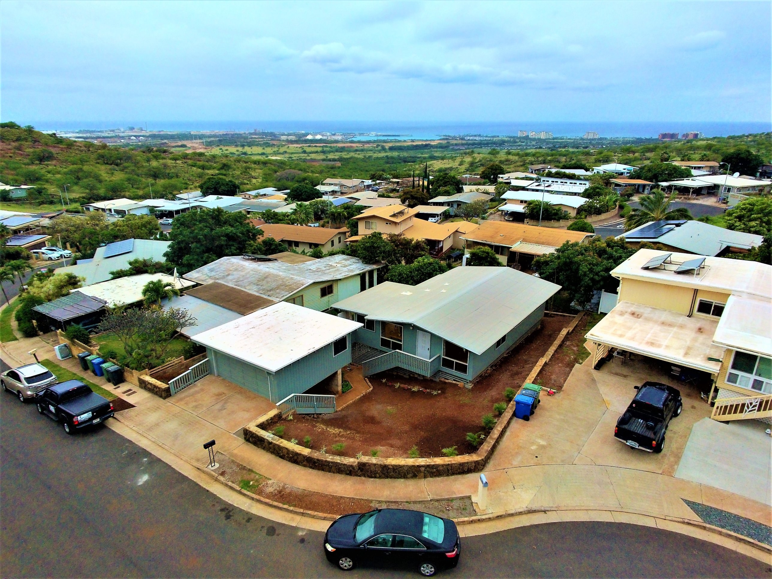 Aerial of Lower Makakilo hillside homes looking down to the Leeward coast