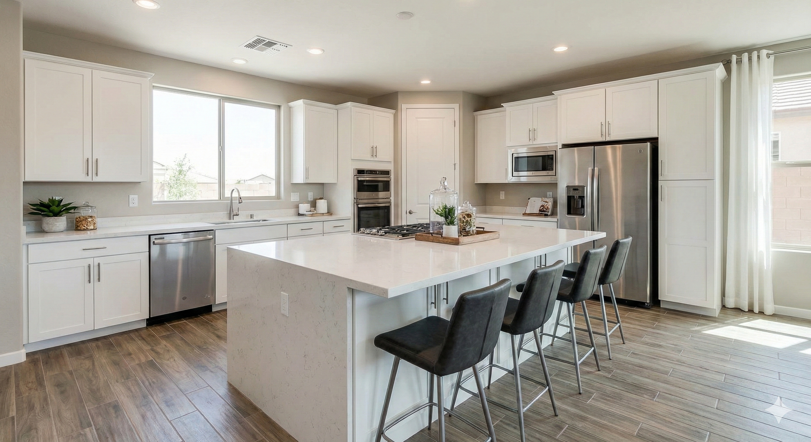 Spacious, modern kitchen interior in a new construction home for sale in Surprise, Arizona.