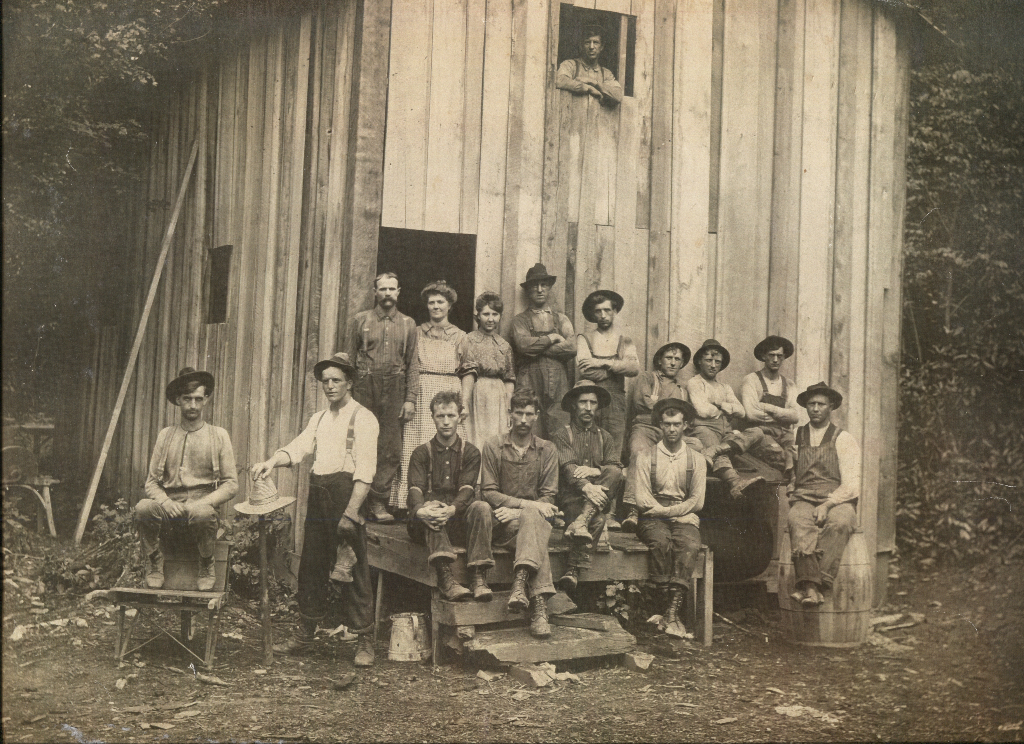 Historic Railey family logging crew outside a building