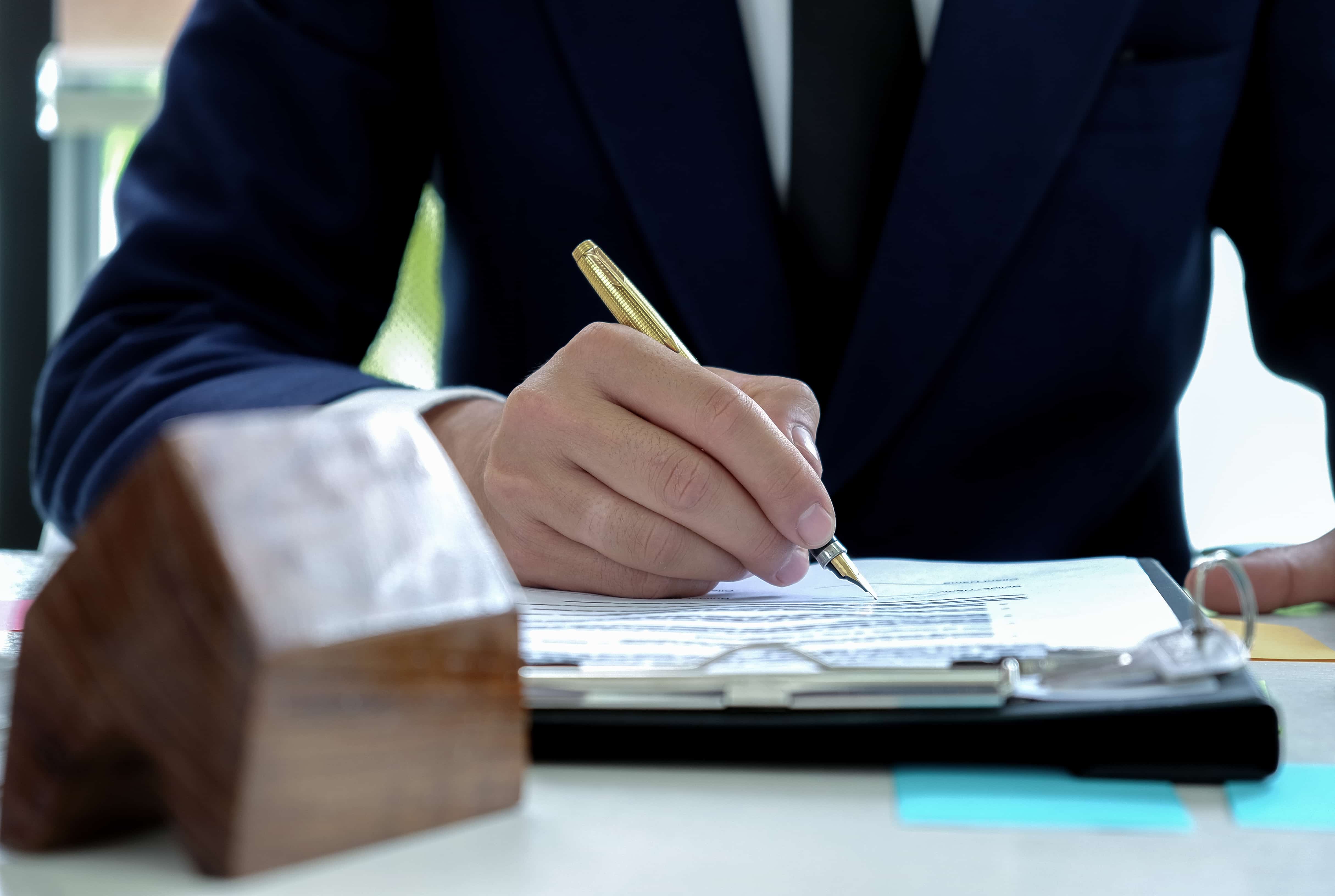 Closing a deal on a house - singing contract